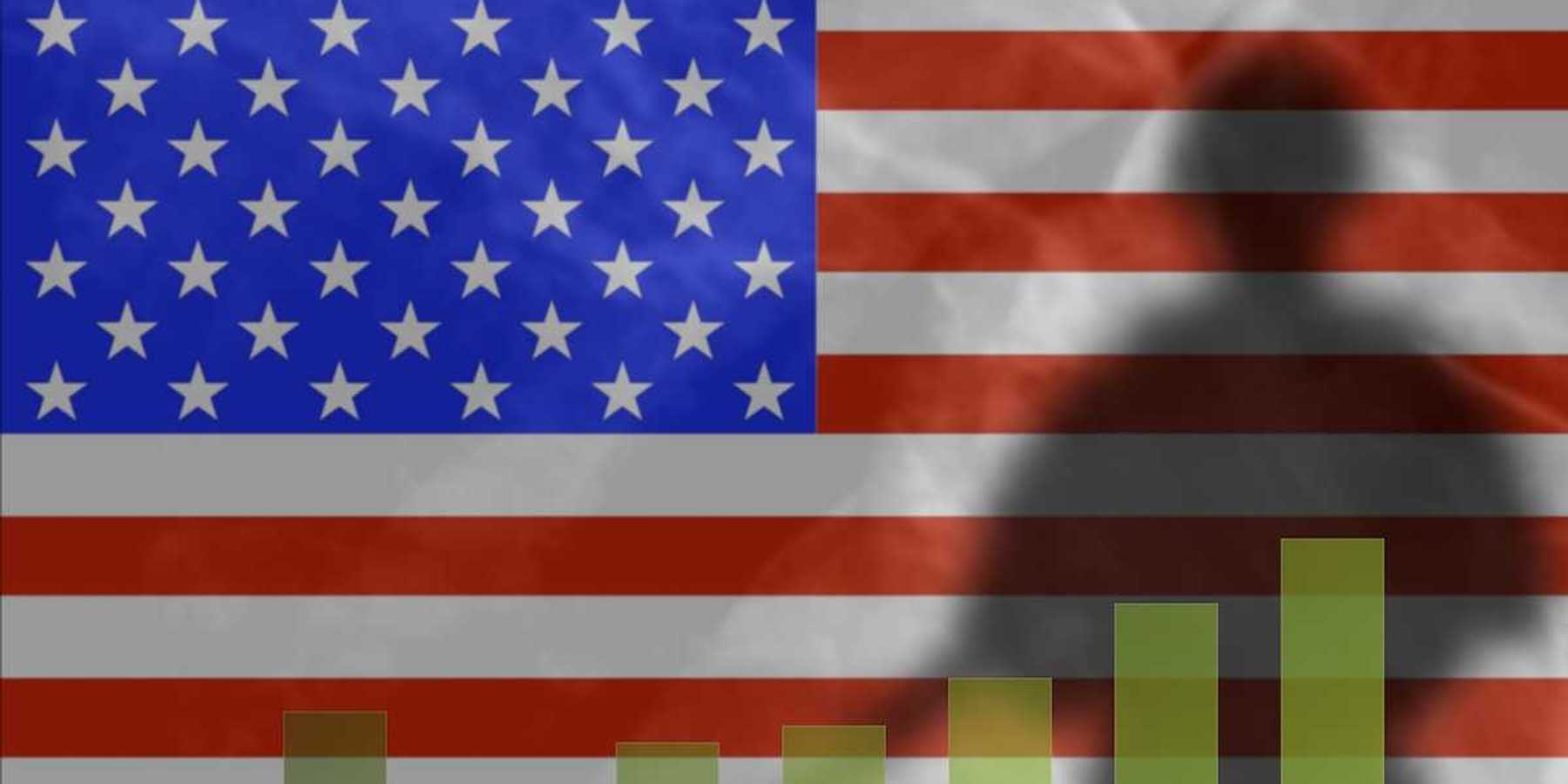 The shadow of a soldier on the background of the American flag. Graph depicts military spending growth chart.