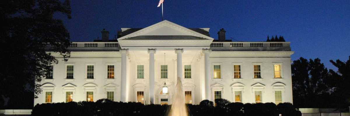 The White House illuminated at night.