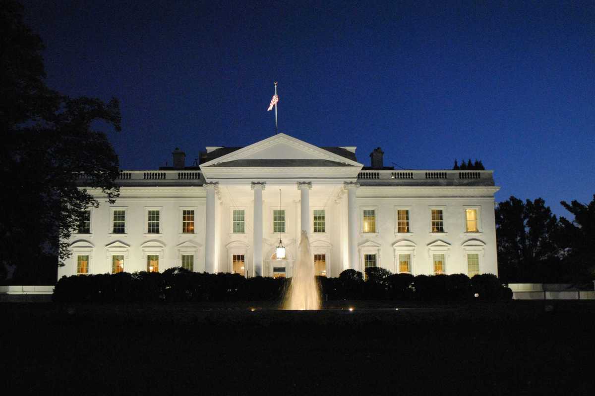 The White House illuminated at night.