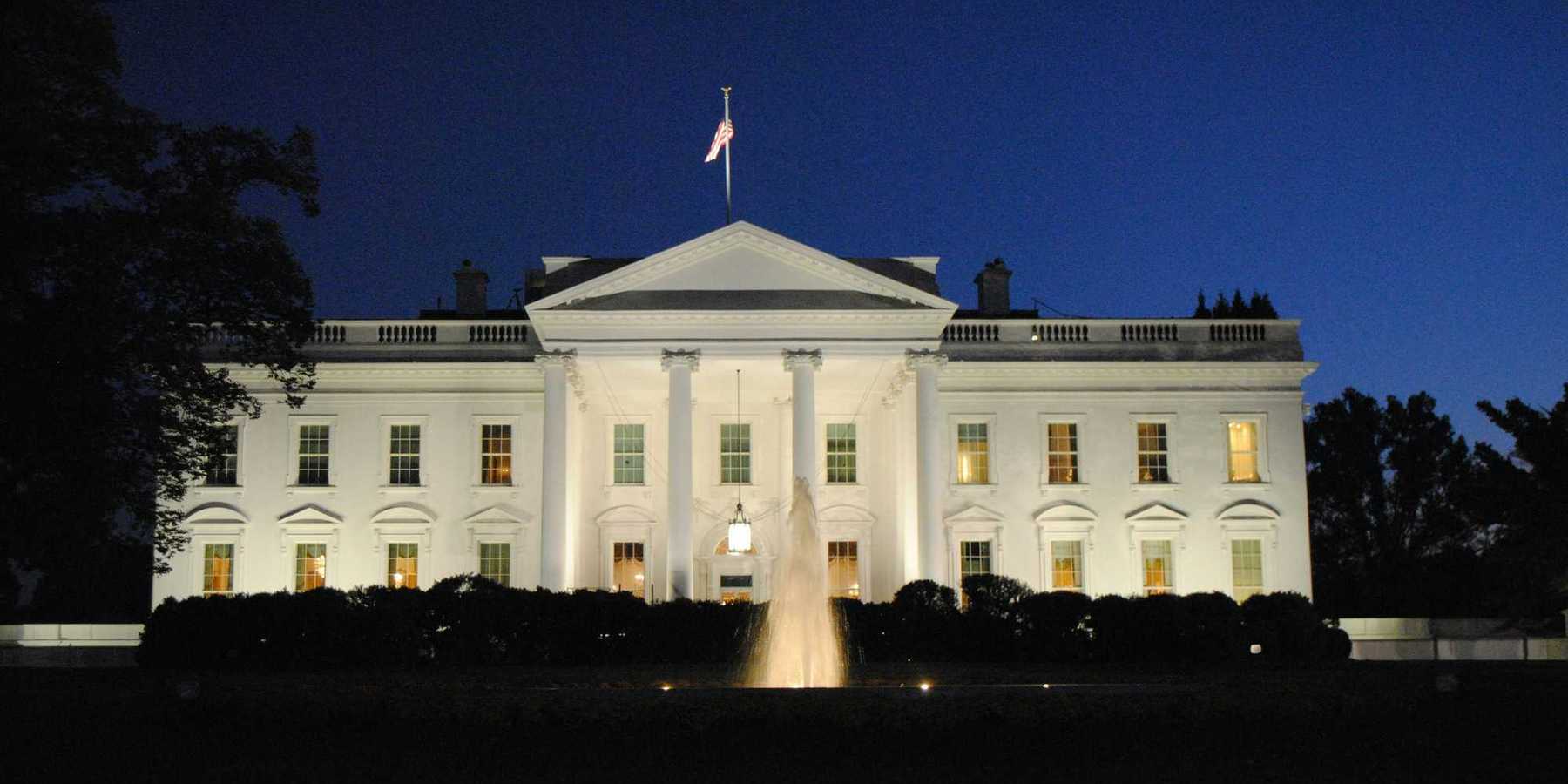 The White House illuminated at night.
