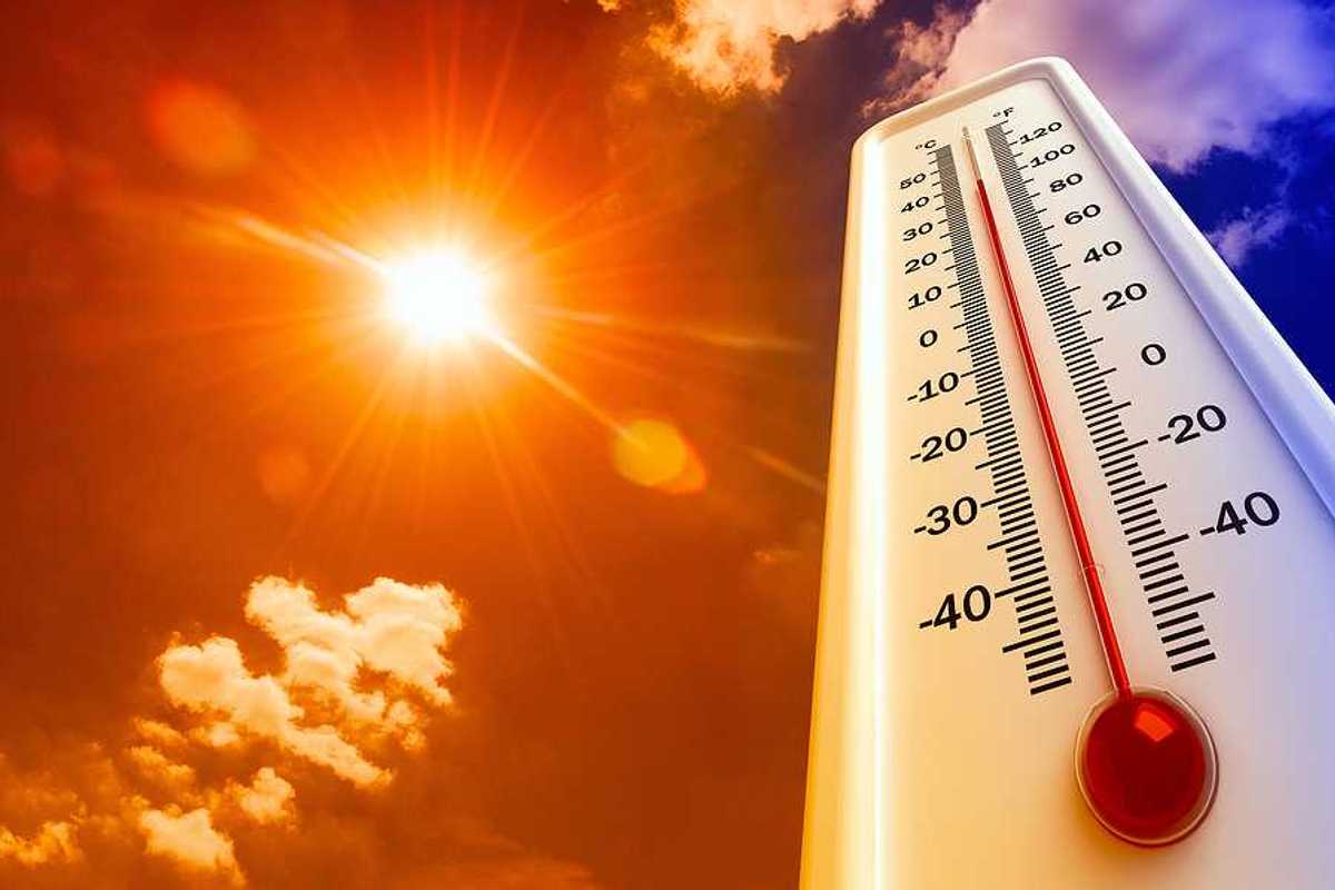 Thermometer with 100 degree reading superimposed against a scorching sunshiney sky