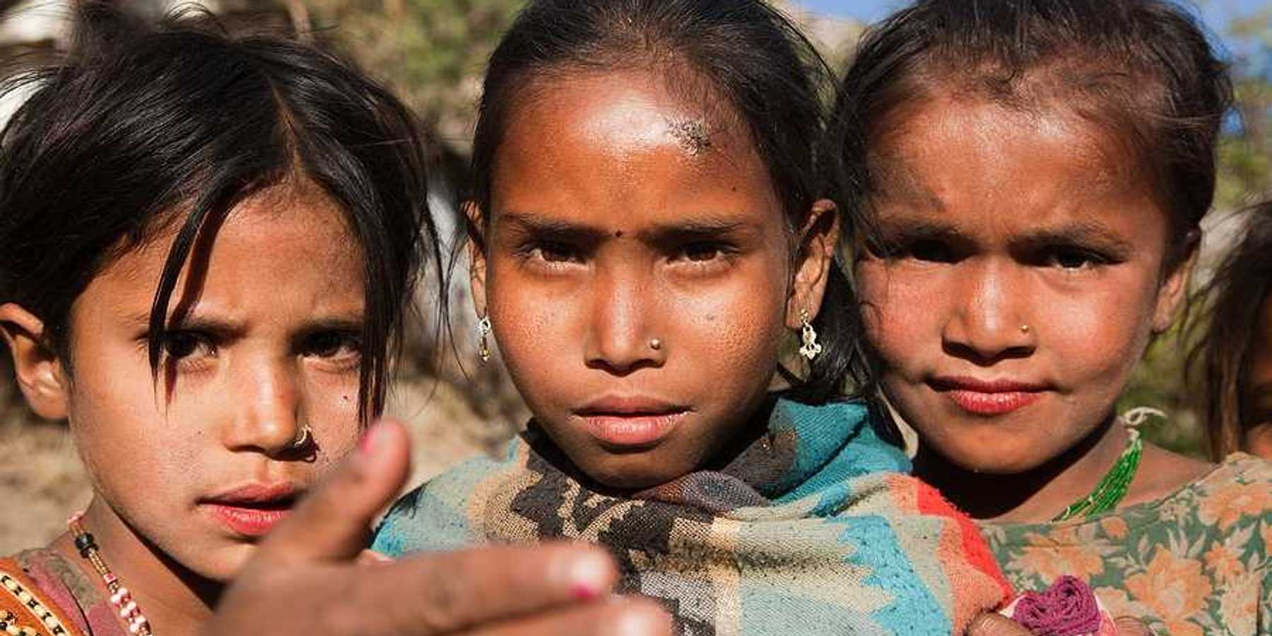 Three young Nepali girls looking into the camera