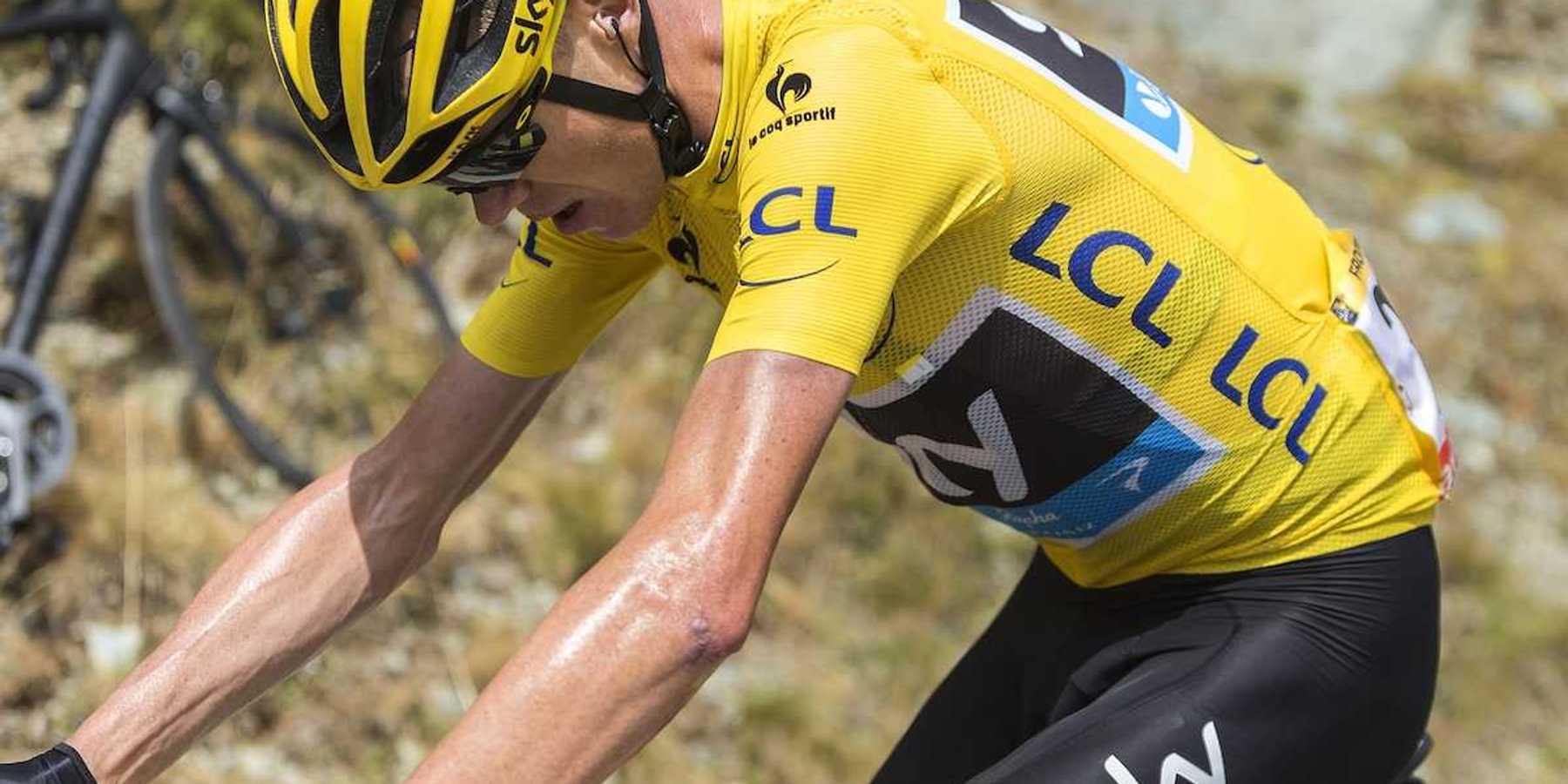 Tour de France rider laboring in yellow jersey