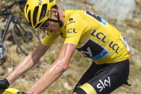 Tour de France rider laboring in yellow jersey