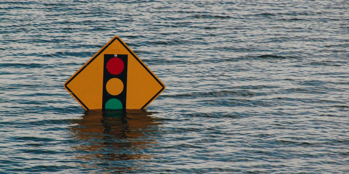 traffic sign in flood water