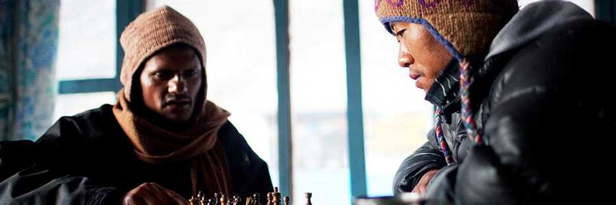 Two Nepalese porters playing chess