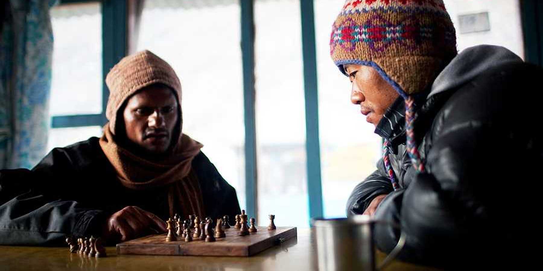 Two Nepalese porters playing chess