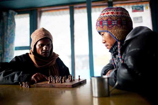 Two Nepalese porters playing chess