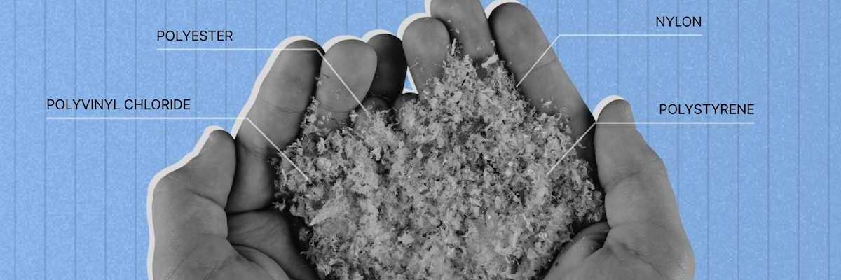Two partially cupped hands holding plastic particles derived from synthetics such as PVC, polyester, nylon, and polystyrene