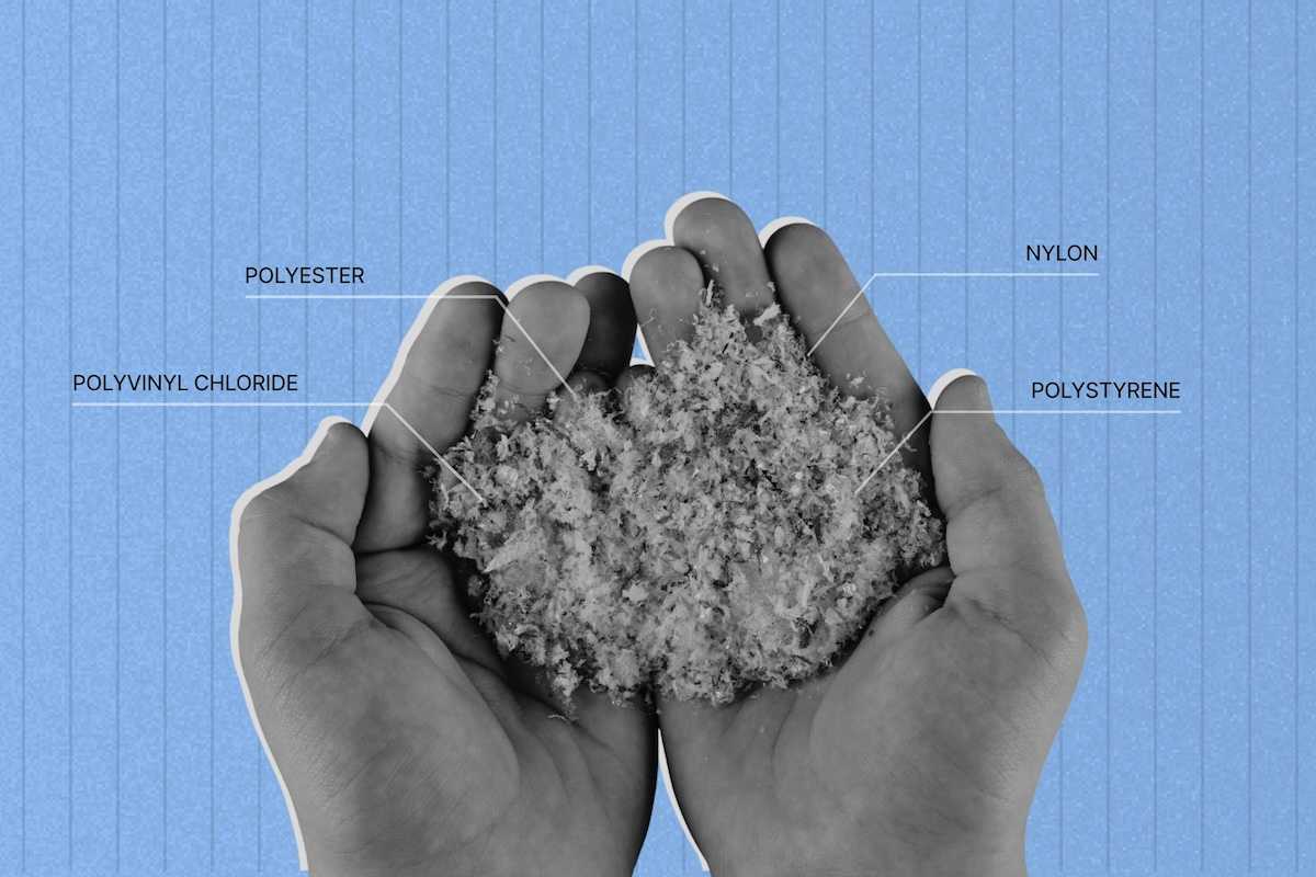 Two partially cupped hands holding plastic particles derived from synthetics such as PVC, polyester, nylon, and polystyrene