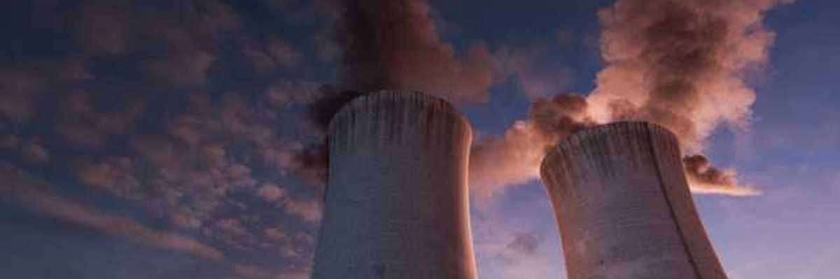 Two power plant towers viewed from below