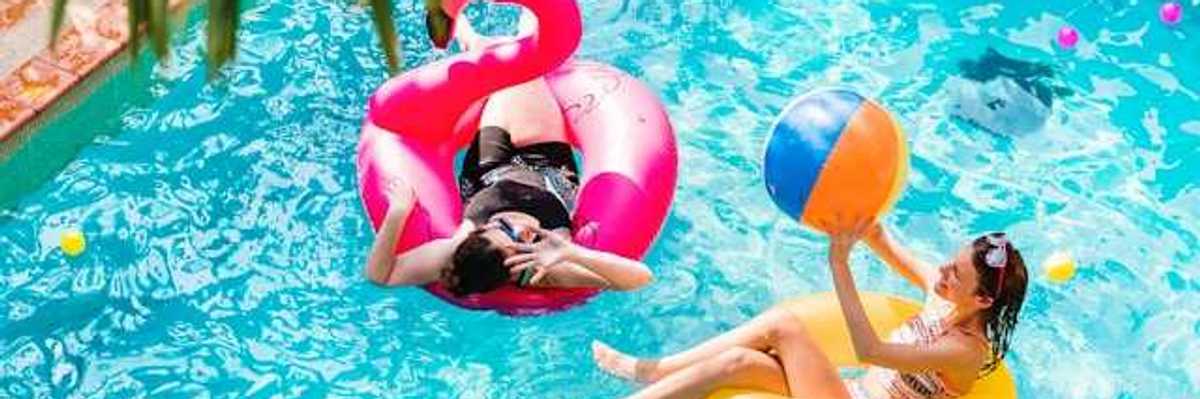Two women floating in a pool