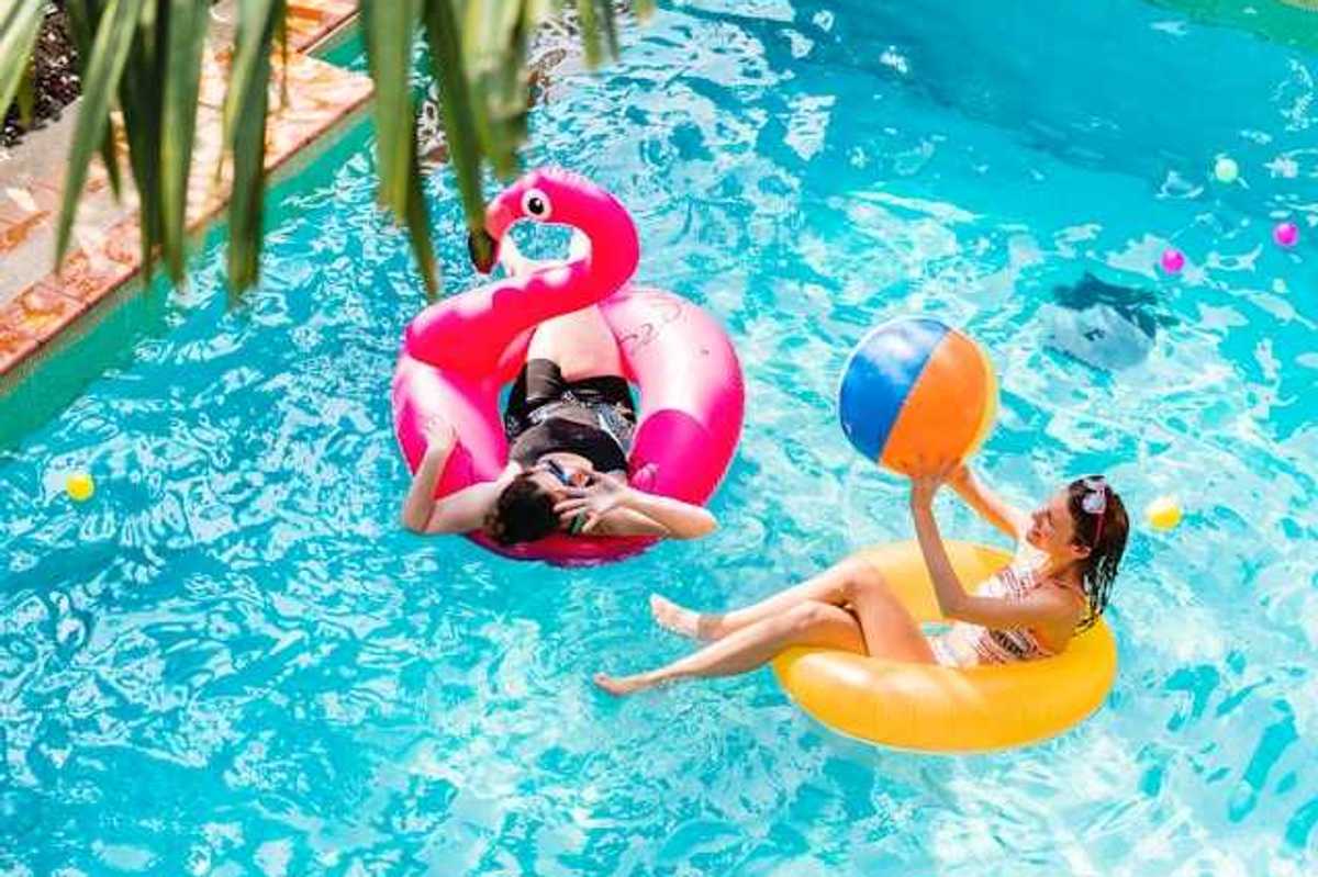Two women floating in a pool