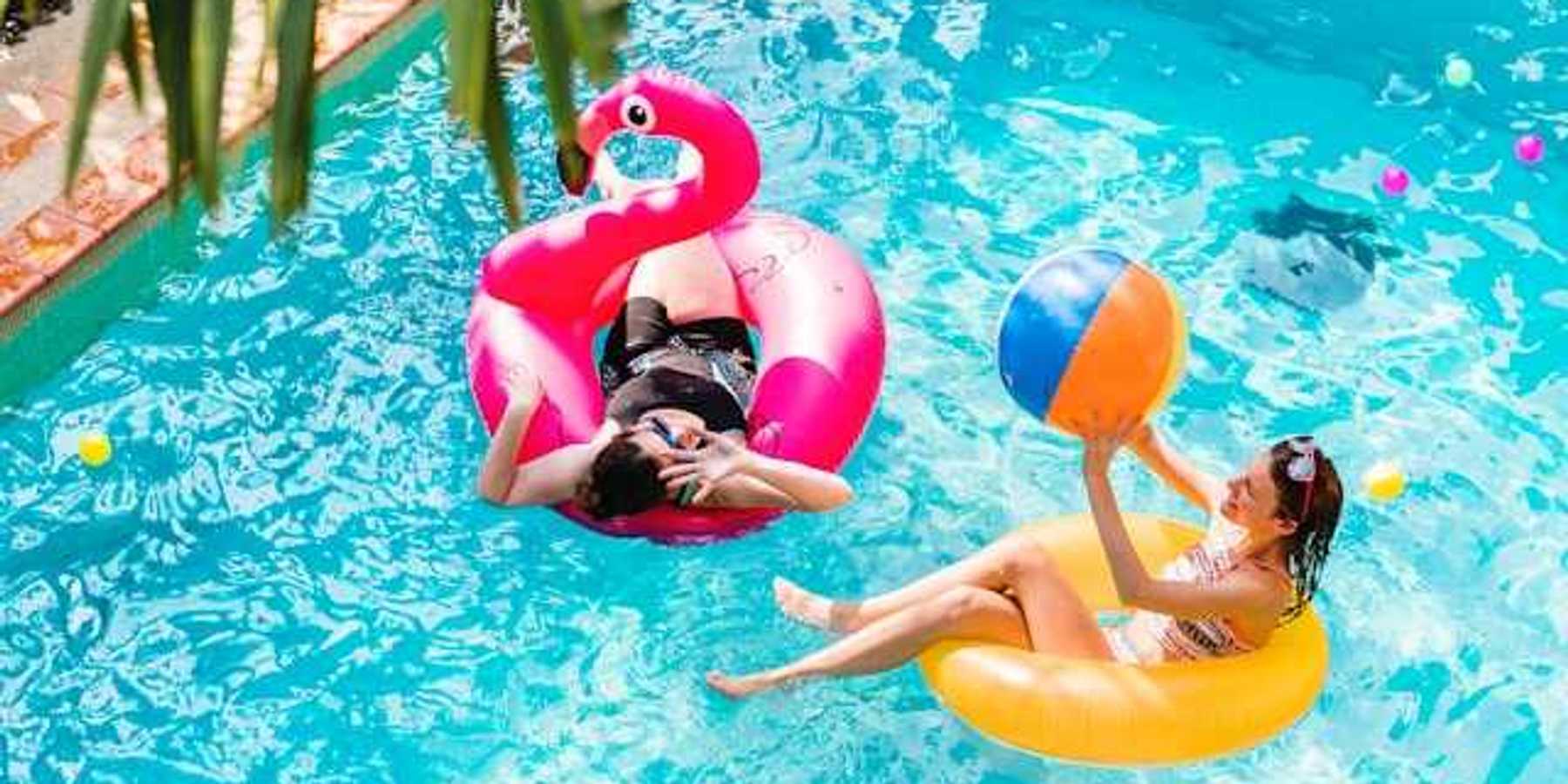 Two women floating in a pool
