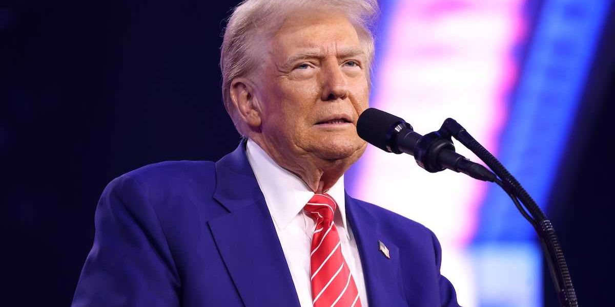 U.S. president Donald Trump speaking into microphone