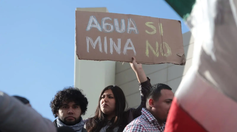 \u200bAn activist protests against a copper project at the Samalayuca mine