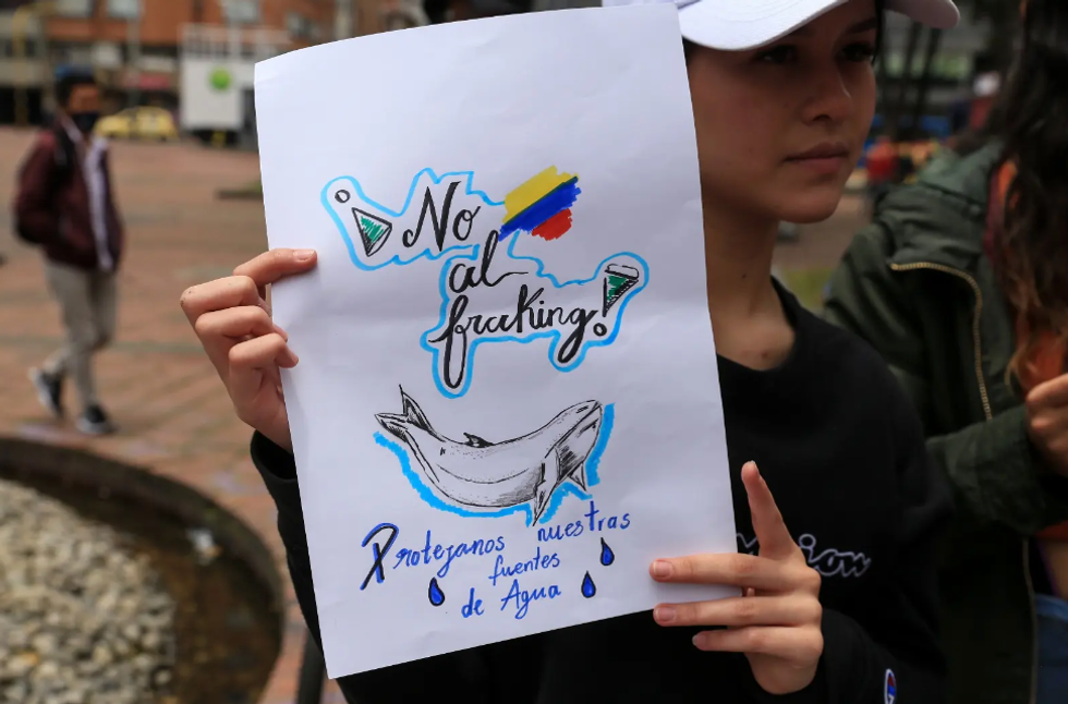 \u200bDemonstrators protest the use of fracking during a 2022 Earth Day event in Bogota, Colombia.
