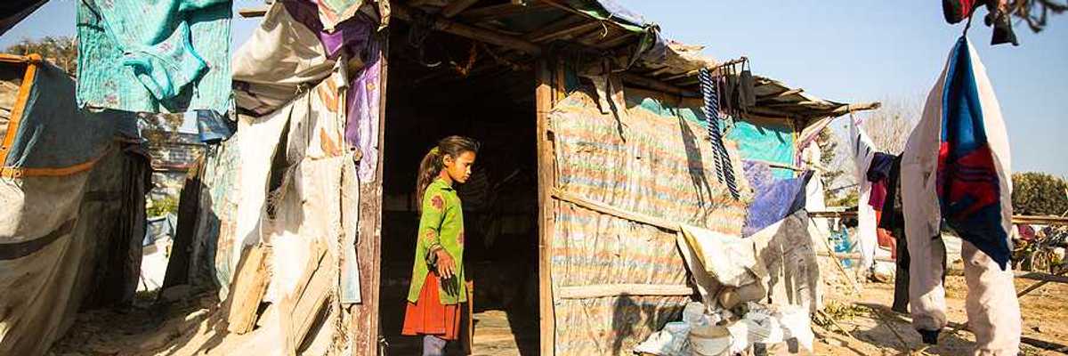 Unidentified poor people near their houses at slums in Tripureshwor district, Kathmandu.