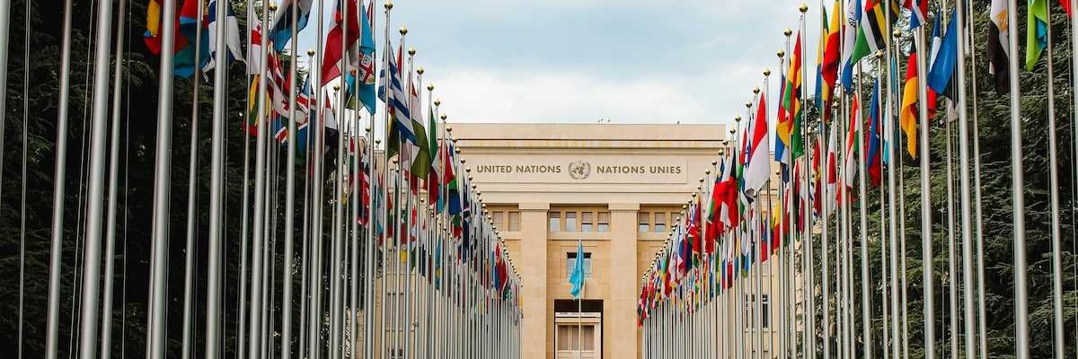 United Nations building with row of flags from member nations