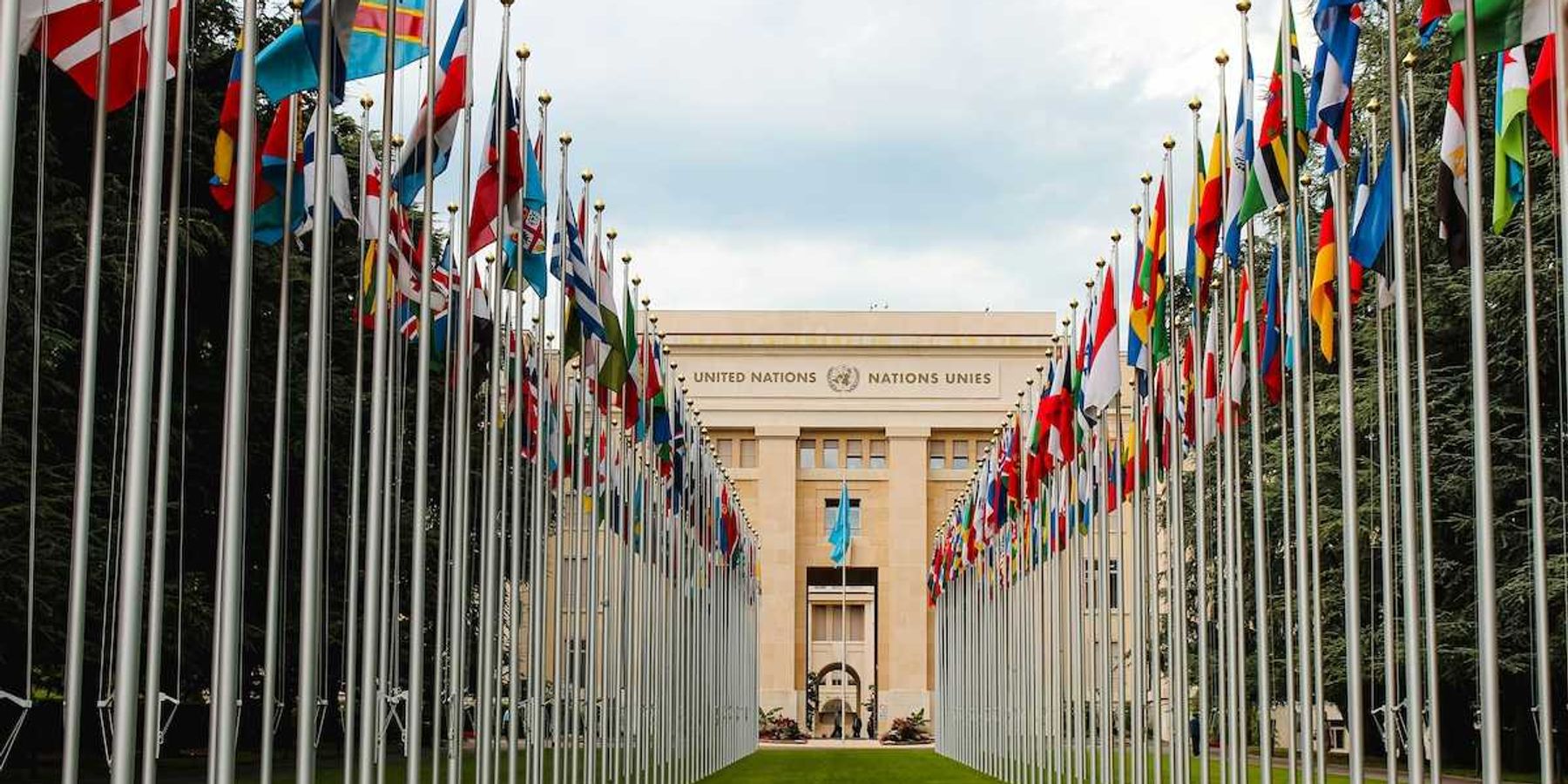 United Nations building with row of flags from member nations