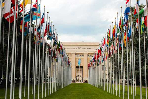 United Nations building with row of flags from member nations