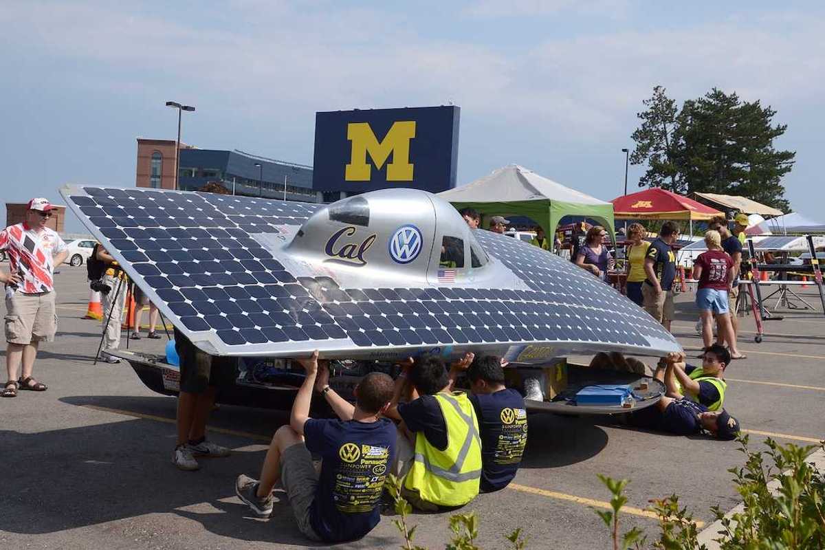 University of California Berkeley's solar car team members recharging their car at the American Solar Challenge stop July 16 2012 in Ann Arbor MI.