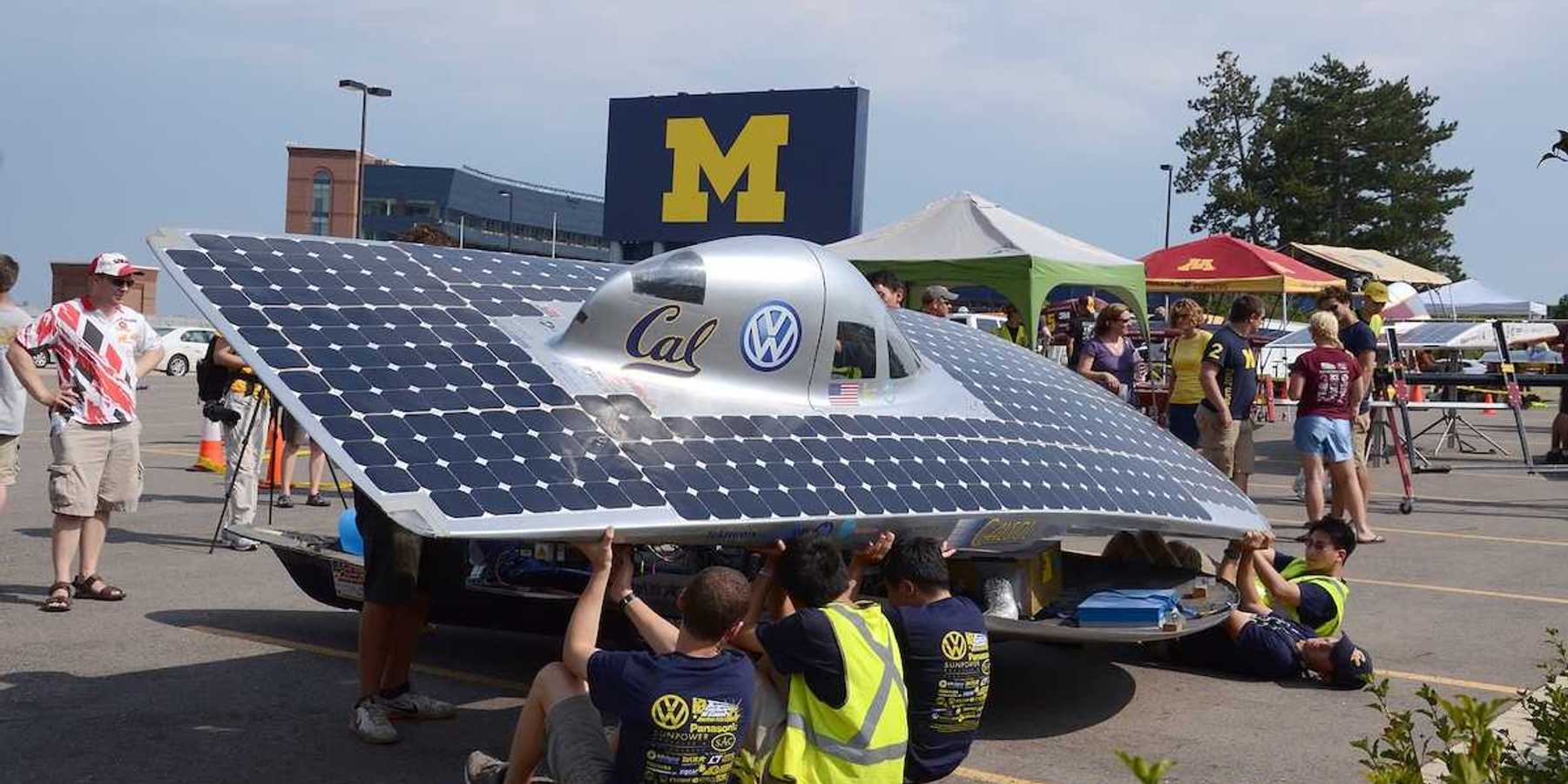 University of California Berkeley's solar car team members recharging their car at the American Solar Challenge stop July 16 2012 in Ann Arbor MI.