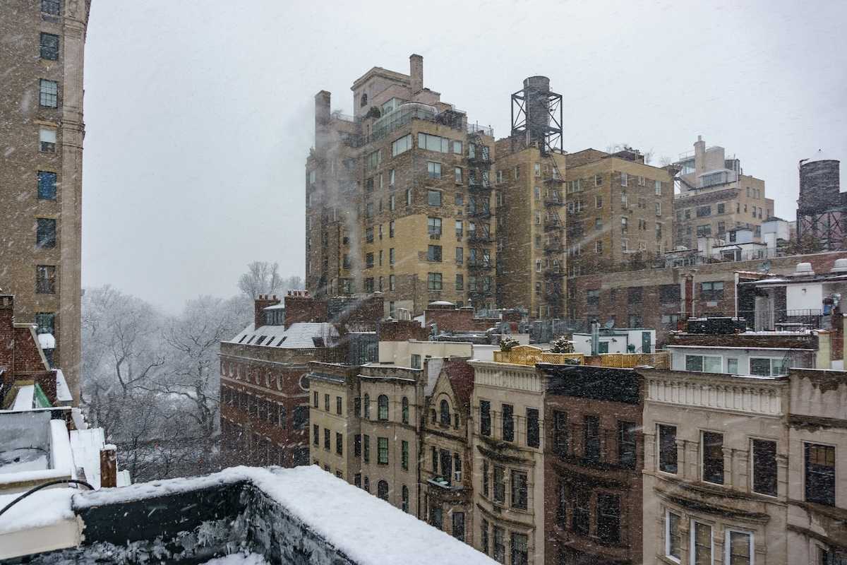 Urban winter scene; tenements at East 94th Street & Madison Avenue, New York, NY, USA