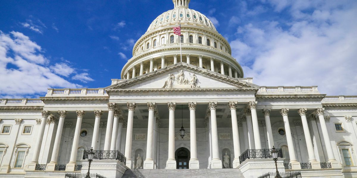 US capitol building against blue sky.