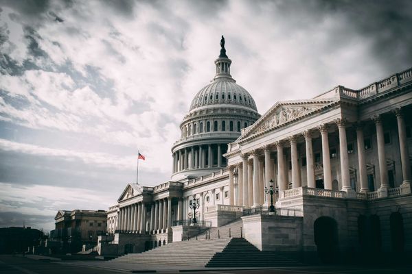 US Capitol under cloudy sky during daytime.
