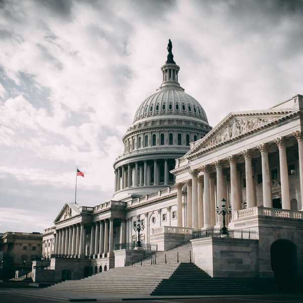 US Capitol under cloudy sky during daytime.