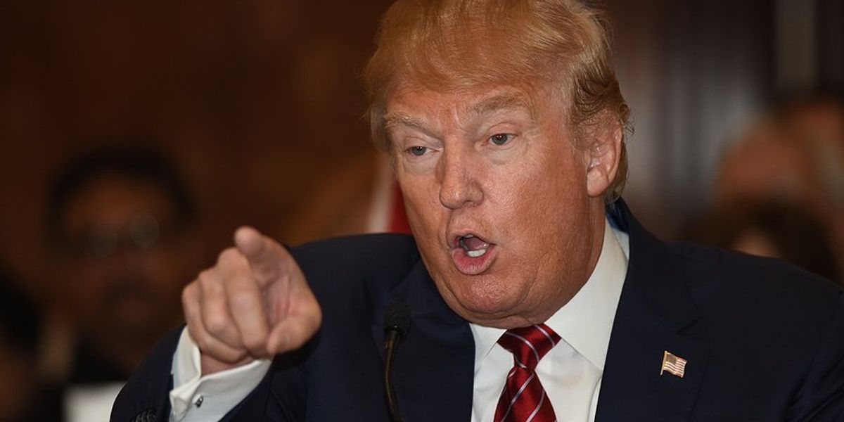 US President Donald Trump gesturing with pointing finger.