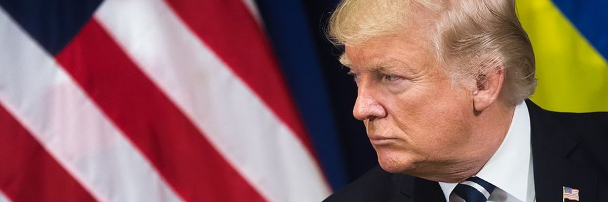 US President Donald Trump with American & Ukrainian flags behind