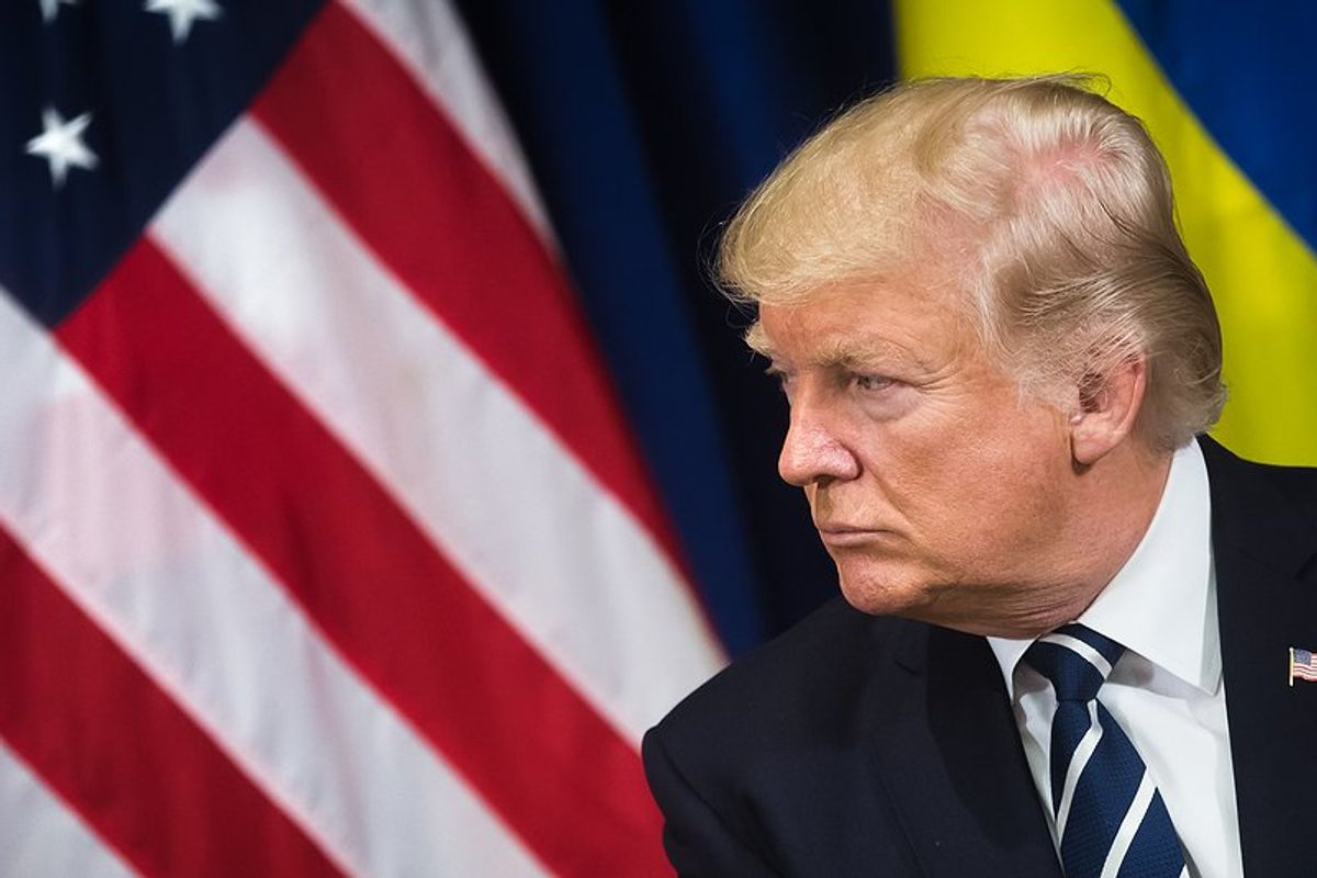 US President Donald Trump with American & Ukrainian flags behind