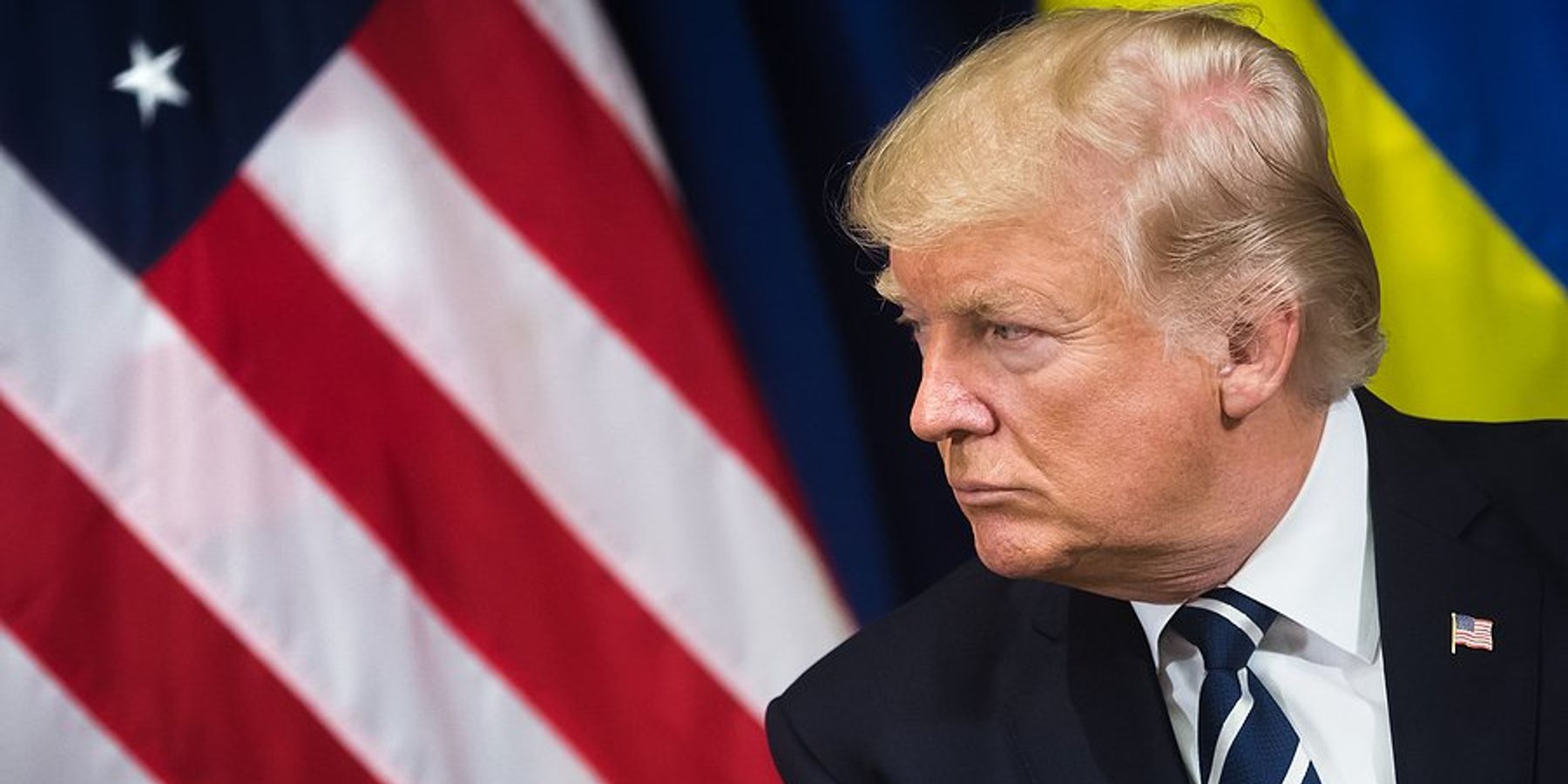 US President Donald Trump with American & Ukrainian flags behind