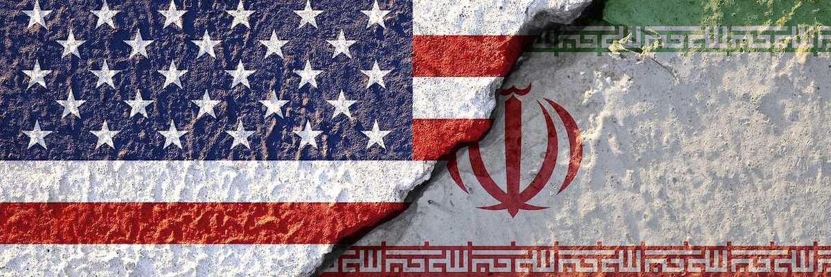 USA flag and Iran flag on cracked wall damage. United state of America and Iran have conflict in nuclear weapons and Strait of Hormuz.