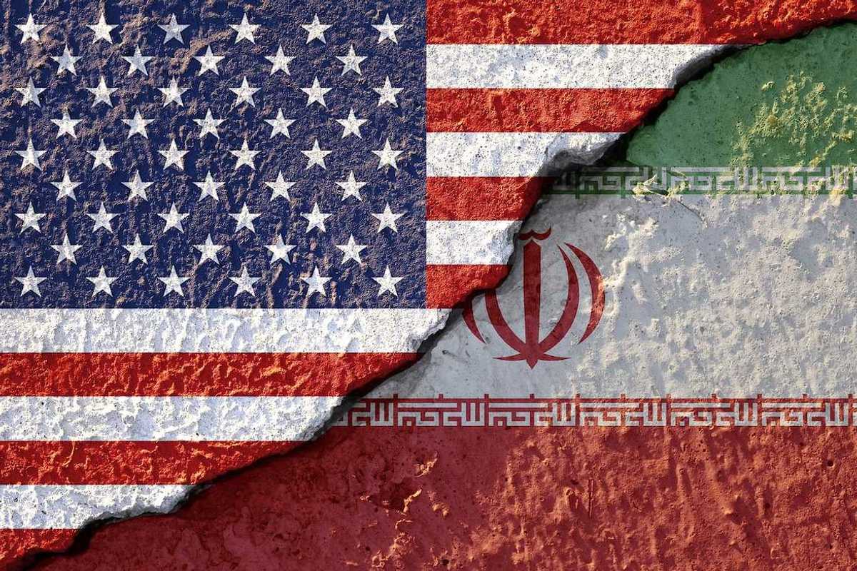 USA flag and Iran flag on cracked wall damage. United state of America and Iran have conflict in nuclear weapons and Strait of Hormuz.