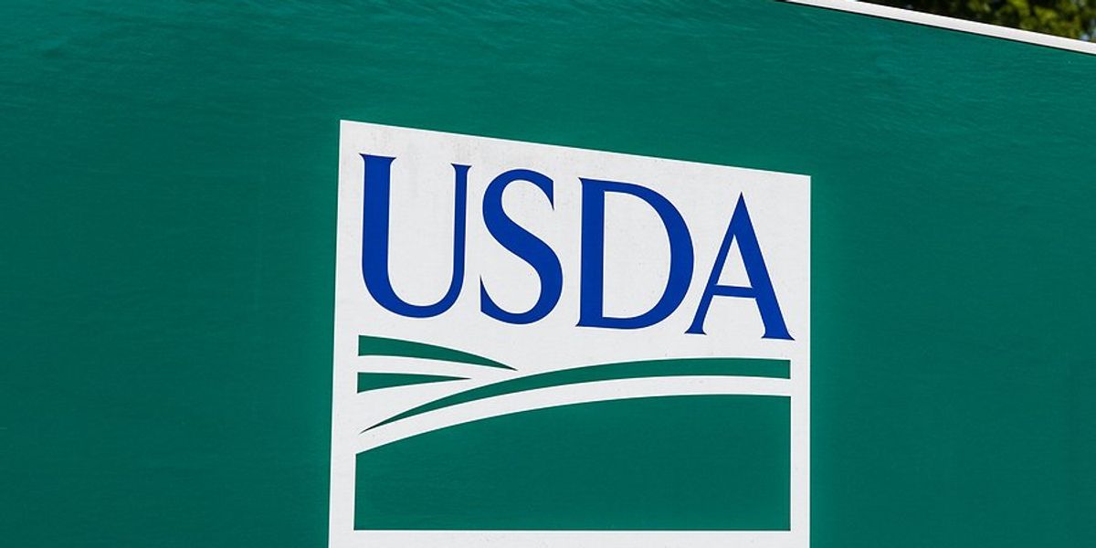 USDA sign on a green wall.