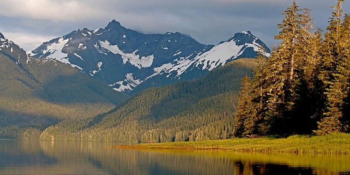 View of a lake with mountains in the background.