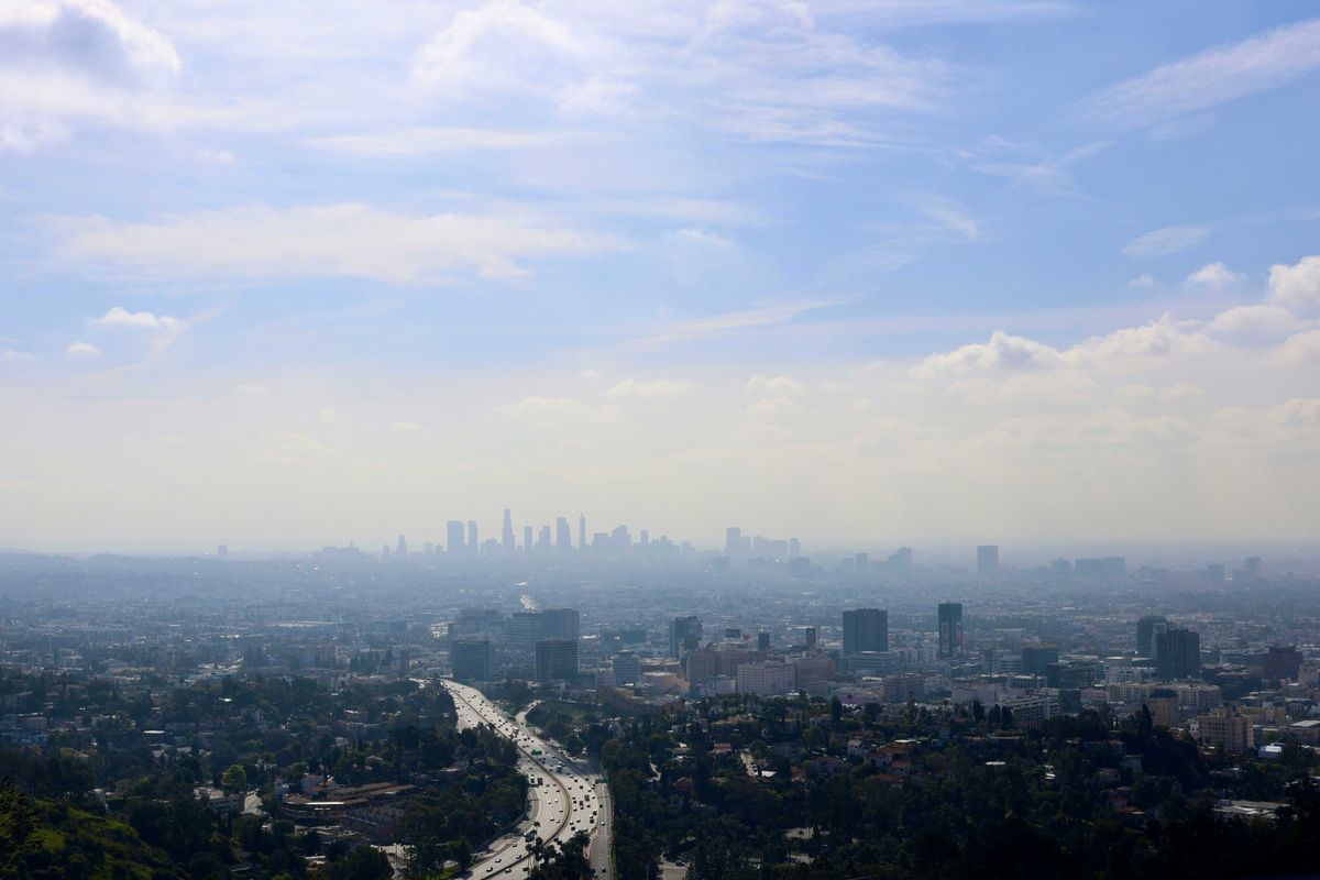 View of Los Angeles skyline shrouded in smog.