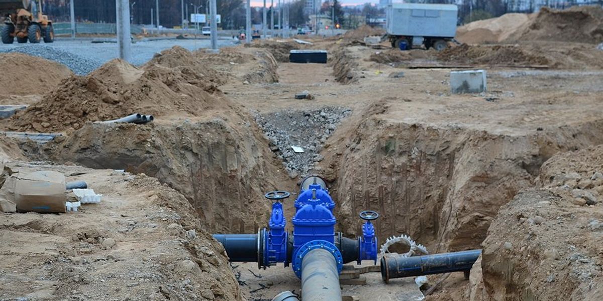 Water pipes being installed in a trench.