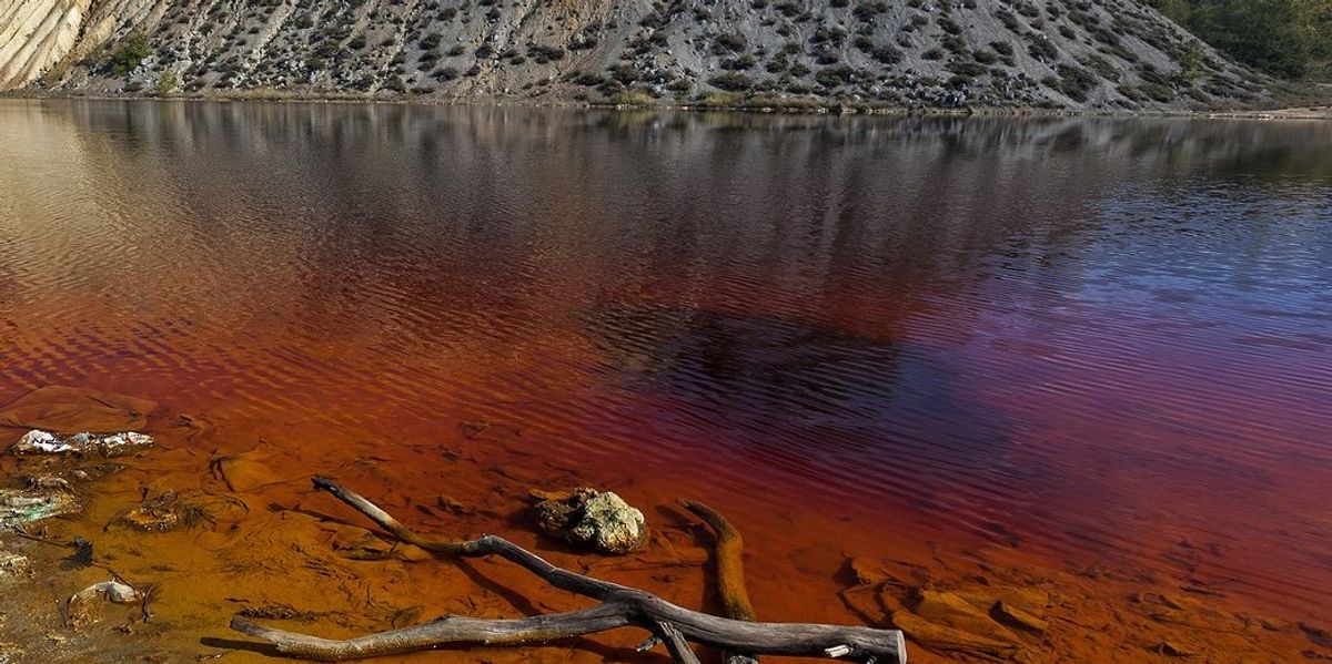 Water pollution from mine tailings contamination.
