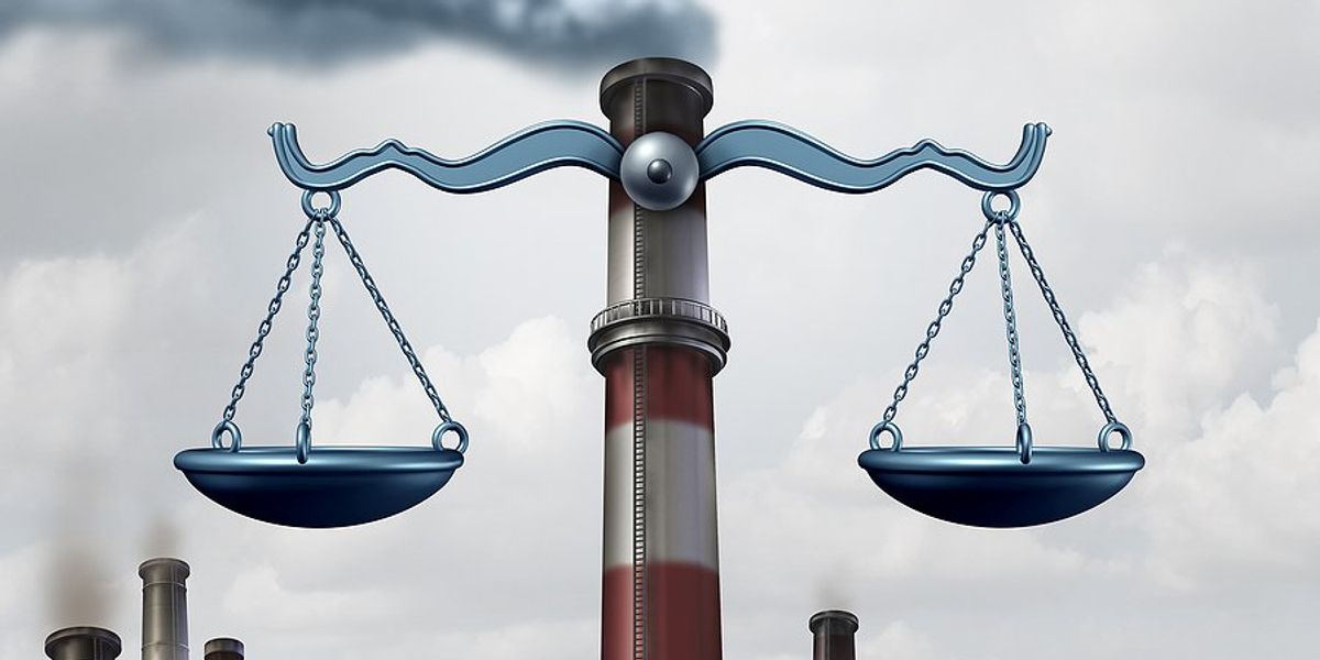 Weight scales on an image of a smokestack.