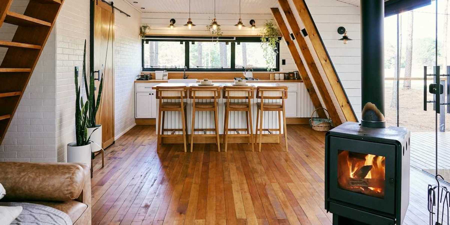 Well-lit home interior heated by wood-burning stove