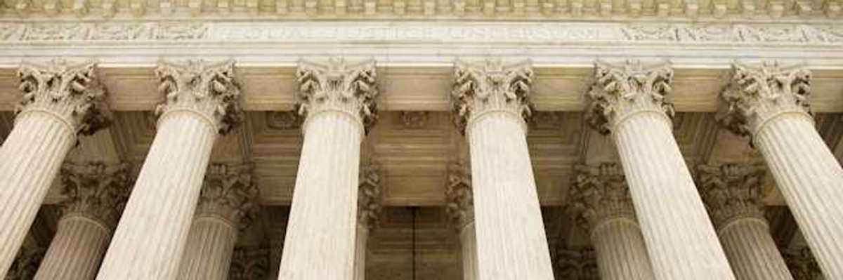 White government building with large decorative pillars