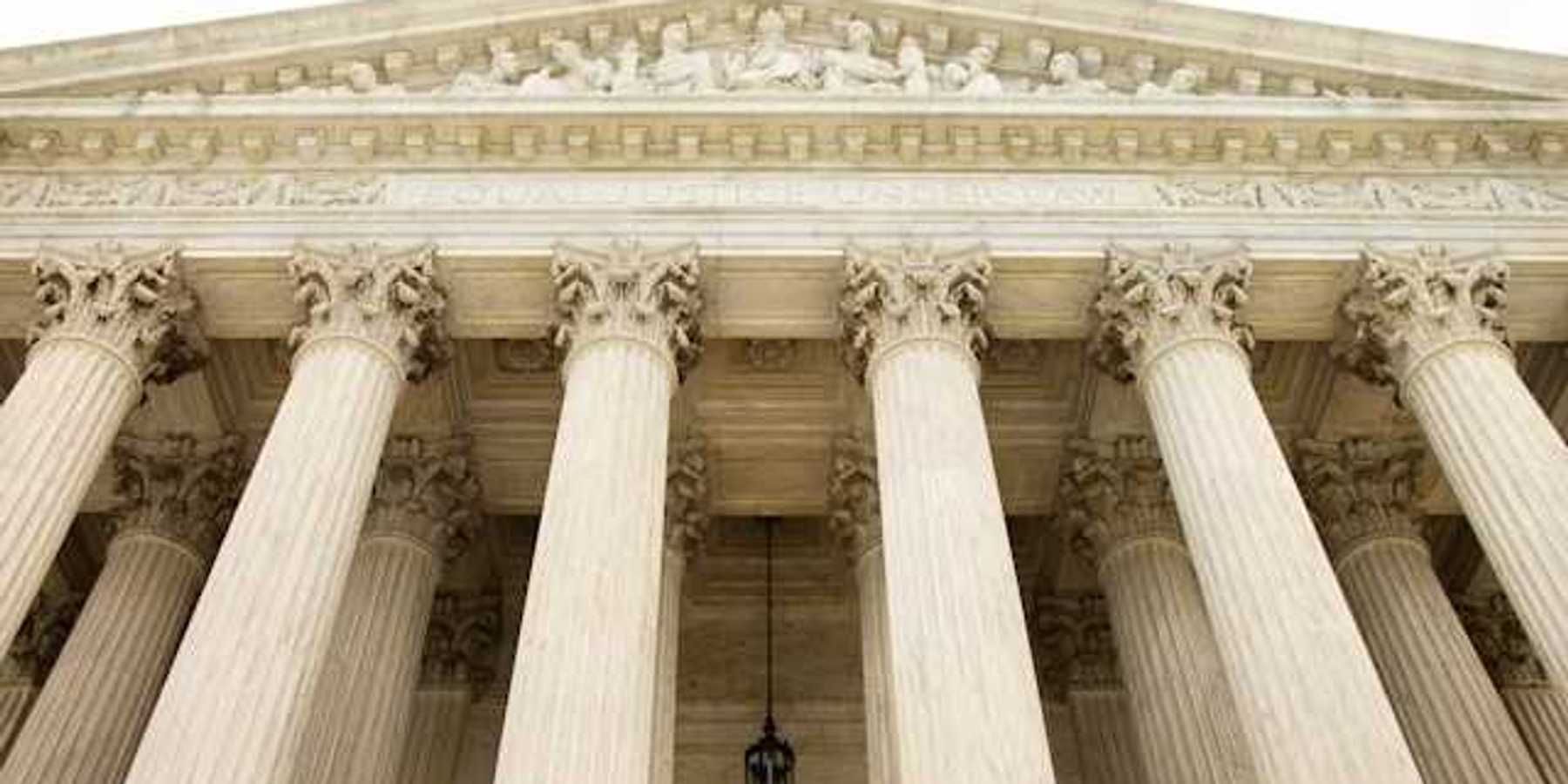 White government building with large decorative pillars