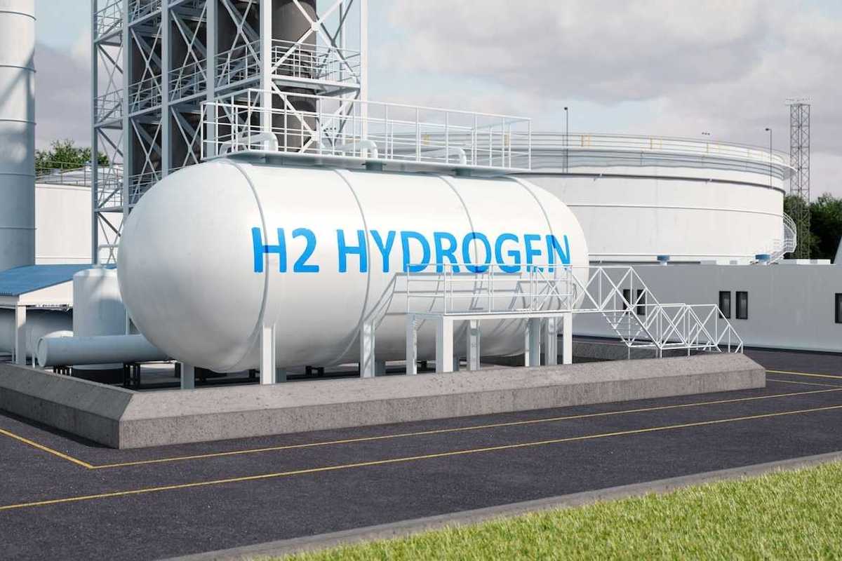 White storage tank lettered "H2 HYDROGEN" in blue letters