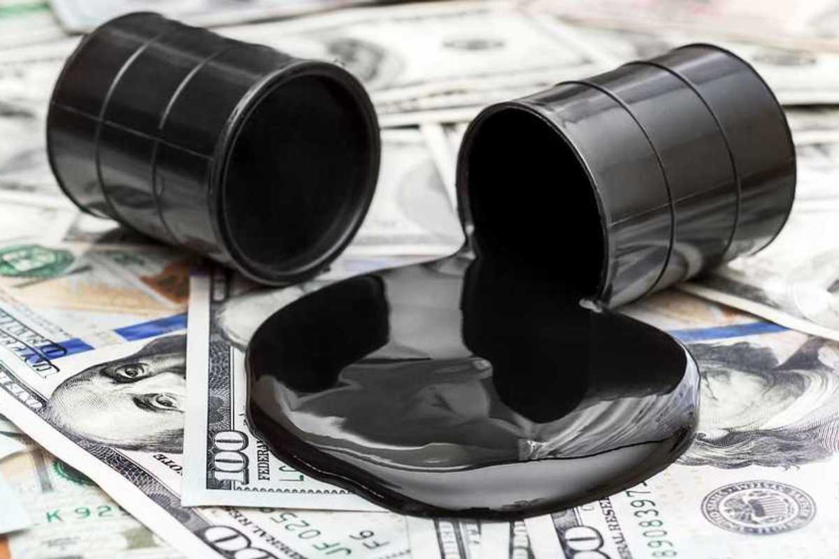 Whole barrel of oil and crude oil spilled from barrel on 100 dollar bills