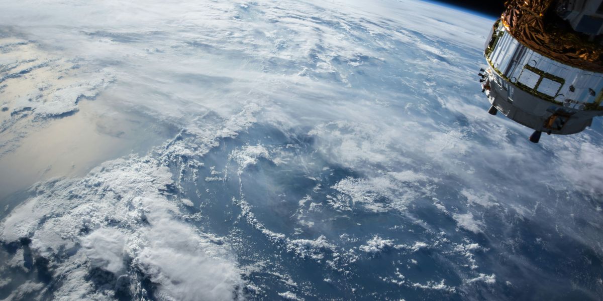 Wiew of Earth and satellite from space.