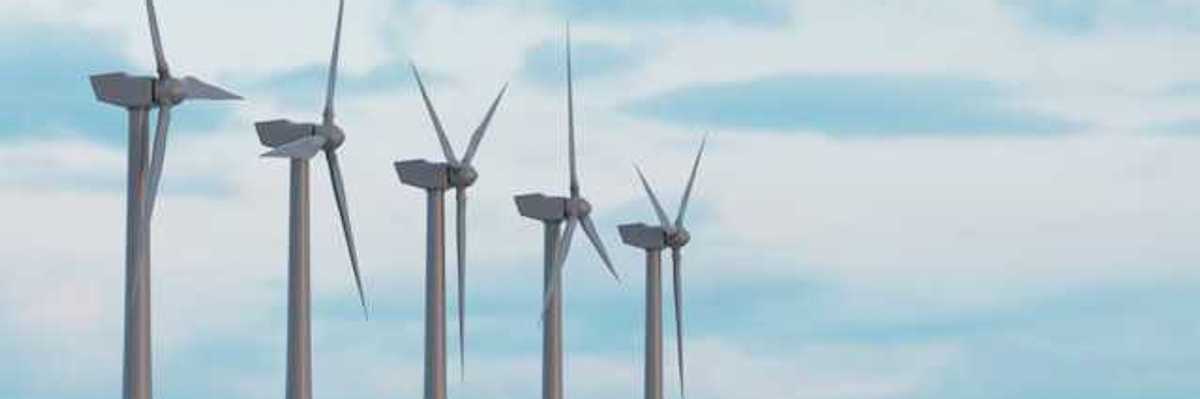 Wind turbines in a row against a blue sky